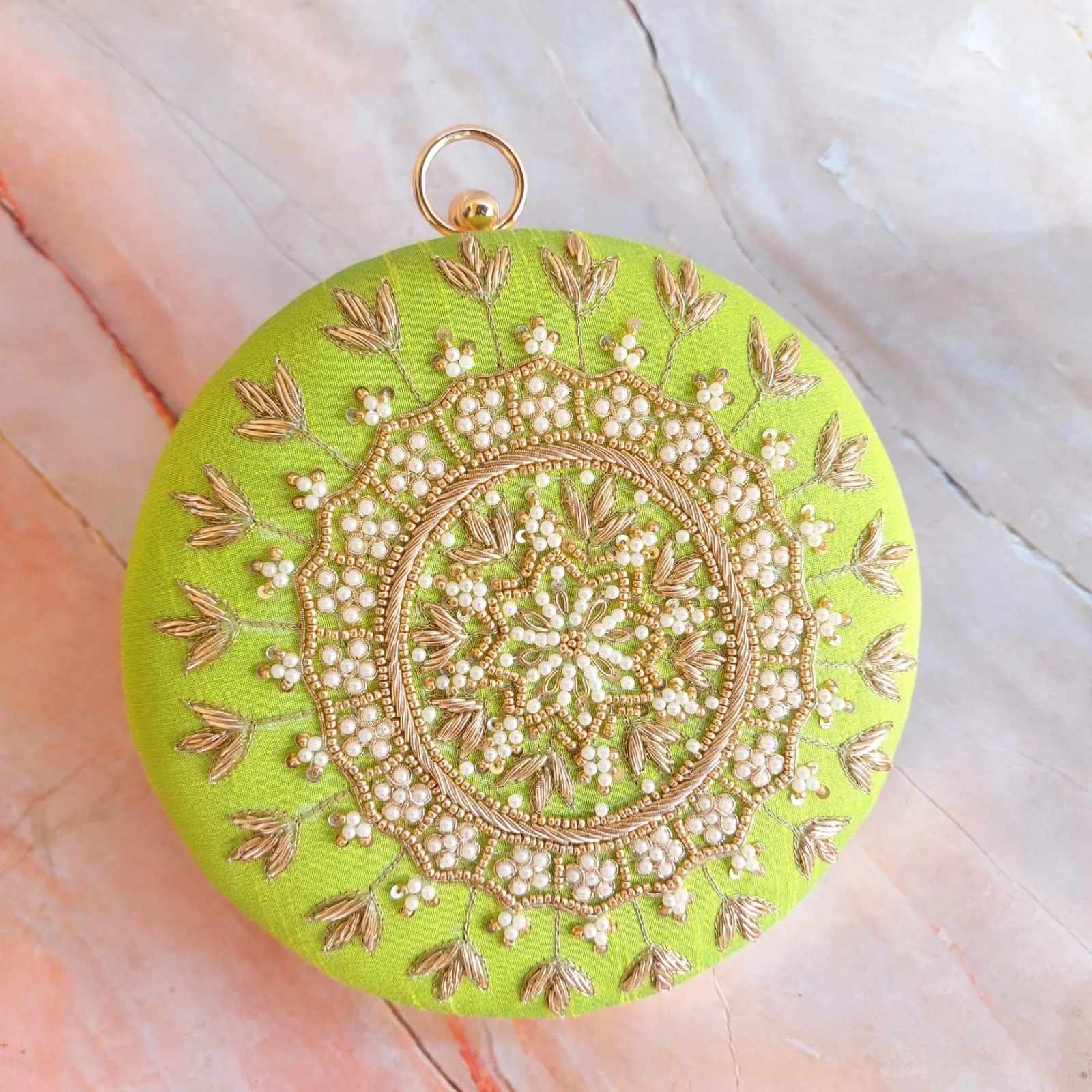 Round embroidery clutch